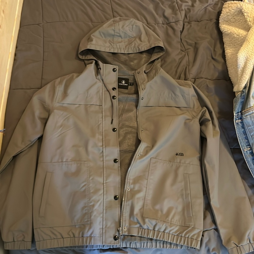 Volcom wind breaker with a hood